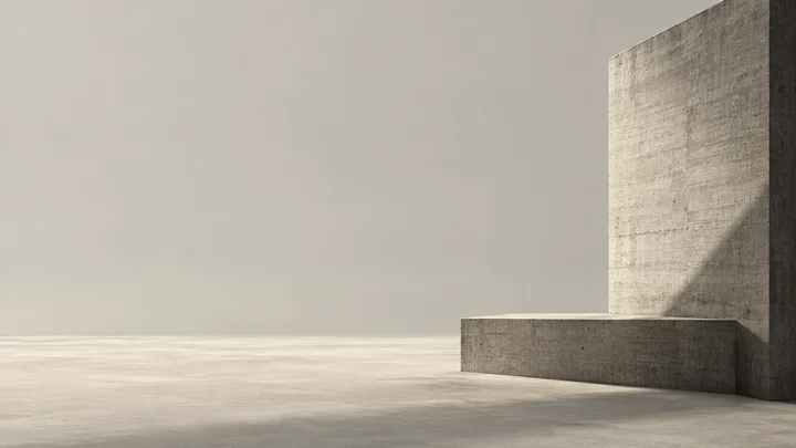 A concrete slab and low plinth in a quiet architectural field